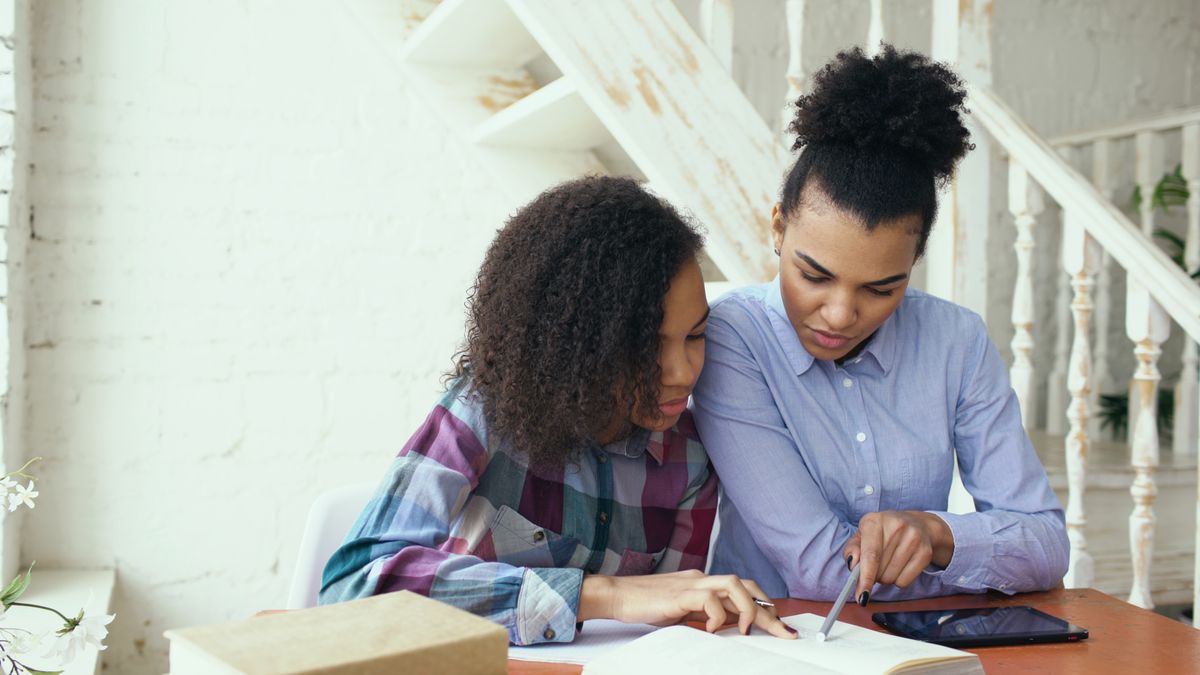 Mother and Daughter Studying at Home