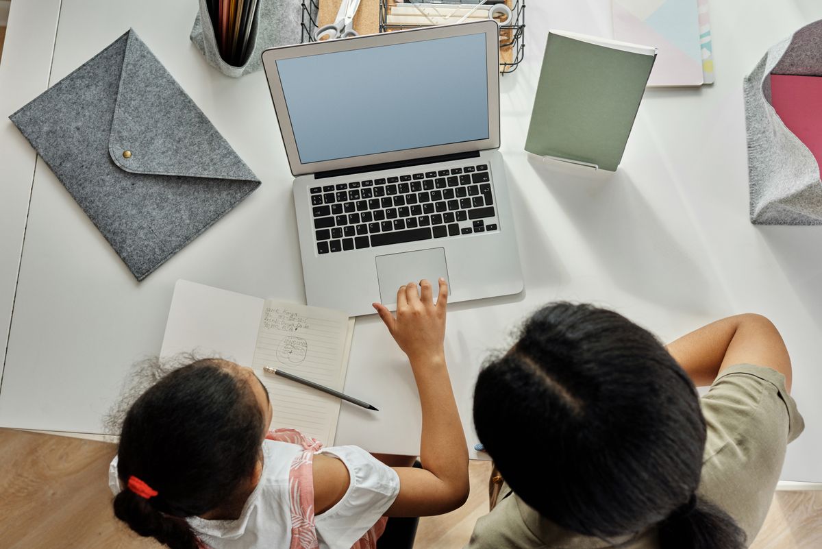 Mother Helping her Daughter with her Homework