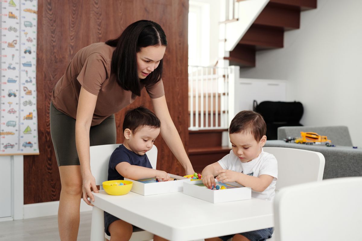 A parent spending time with children in the kitchen