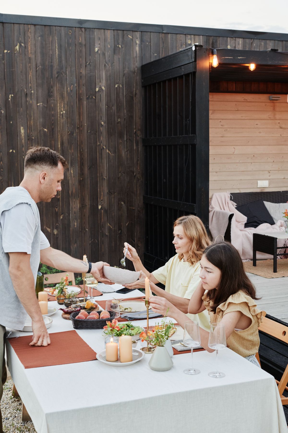 A Family Having Dinner in the Backyard